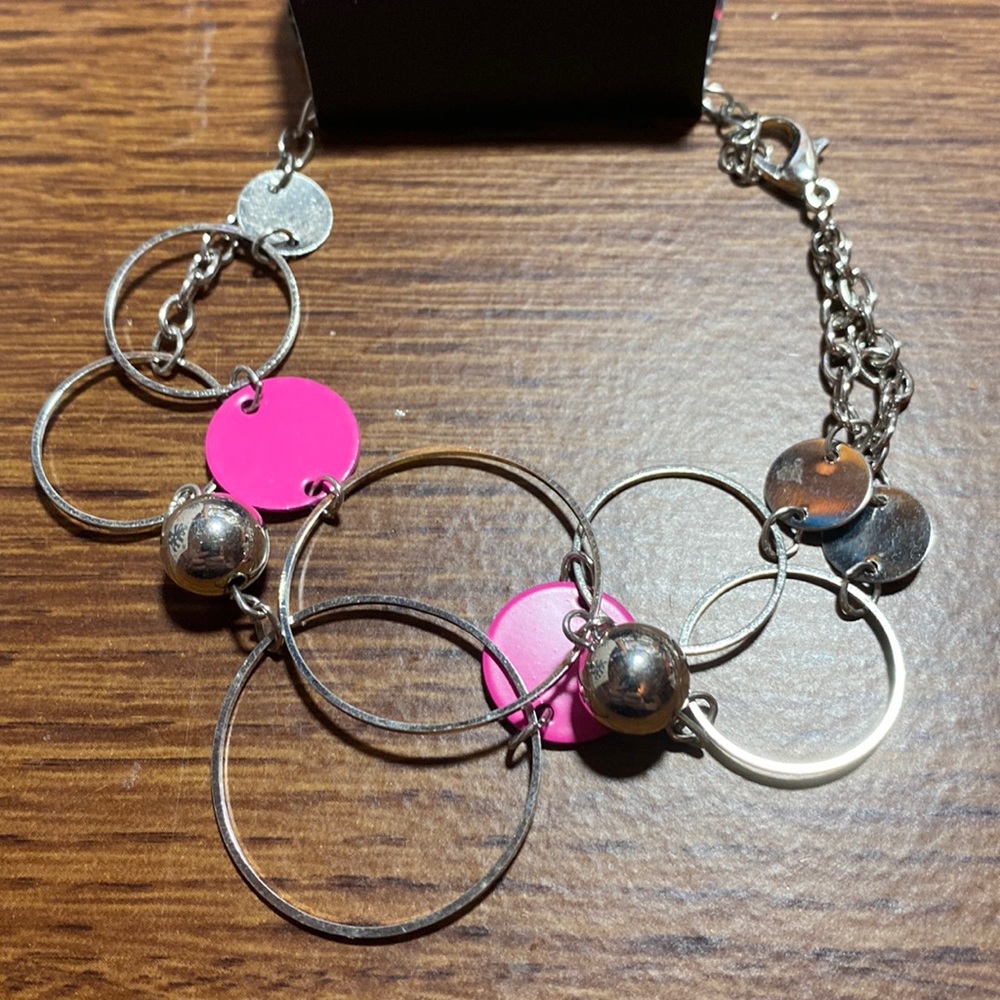 Silver bracelet with pop of pink